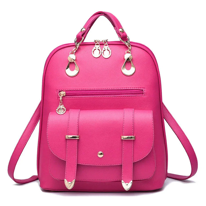 Bright pink women's backpack with front pocket, gold-tone hardware, and adjustable straps