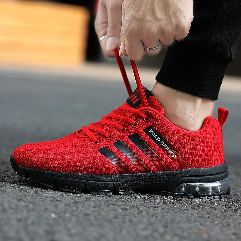 Red breathable running shoe with black sole and stripe details, labeled 'keep running'