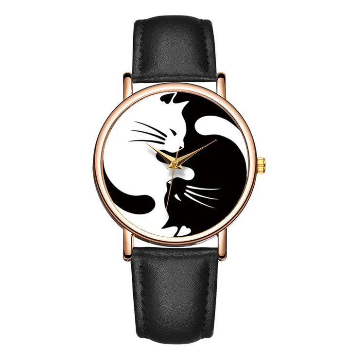 Round wristwatch with black leather strap featuring yin-yang design with black and white cats