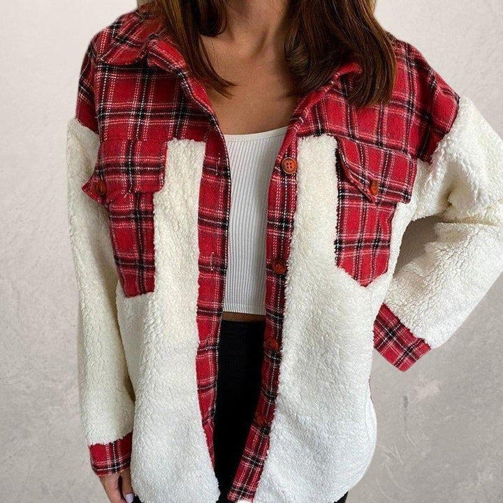 Woman wearing red plaid and white sherpa fleece jacket over white ribbed crop top