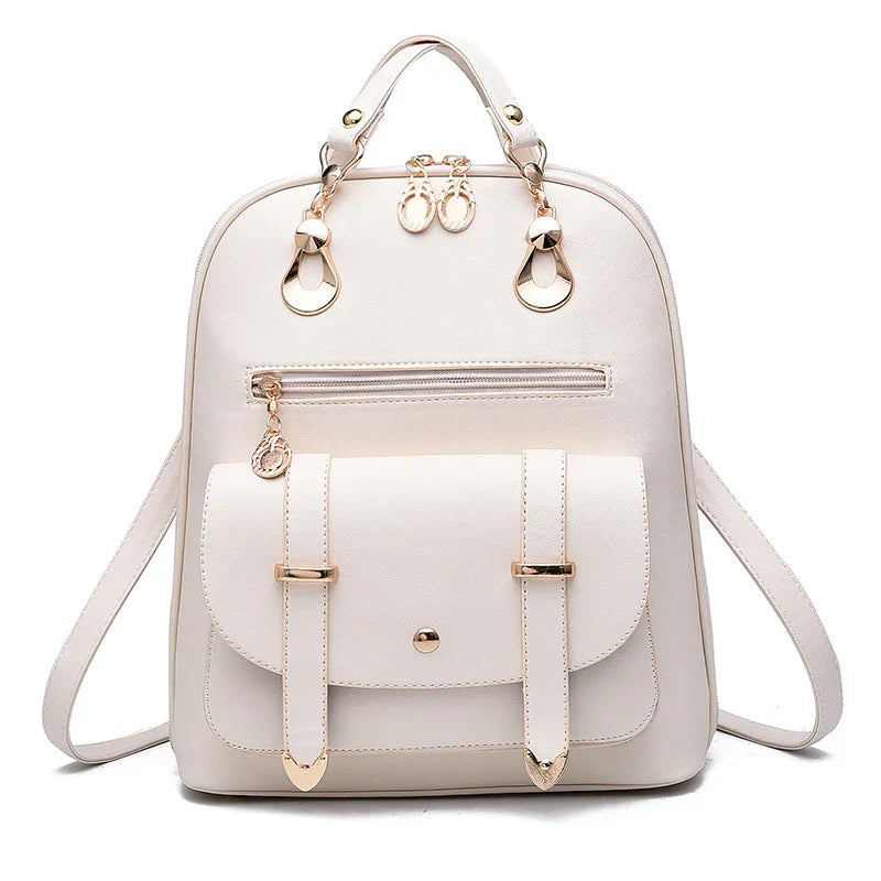 Elegant white leather backpack with gold hardware, front zipper pocket, and adjustable straps