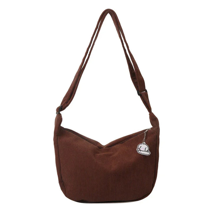 Brown corduroy shoulder bag with adjustable strap and small cloud keychain
