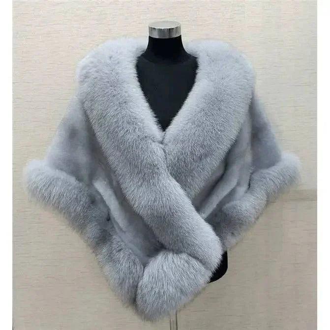 luxurious light gray fur shawl with plush collar and cuffs displayed on black mannequin
