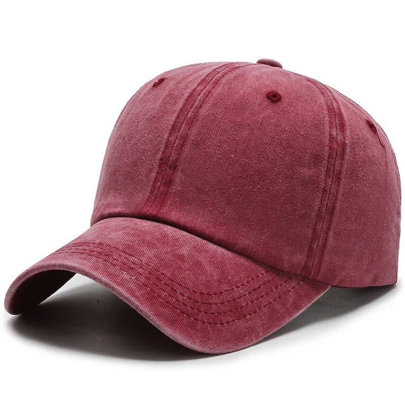 Maroon washed cotton baseball cap with curved brim and stitched panels