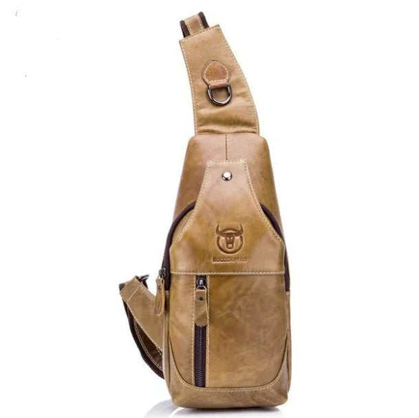 tan leather sling backpack with multiple zippered compartments and embossed bull logo