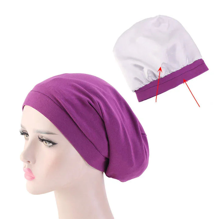 Purple cotton slouchy beanie on mannequin head with white interior lining detail
