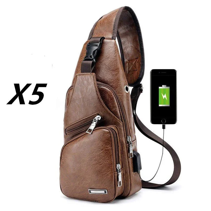 Brown leather sling bag with multiple zippered pockets and USB charging port with phone charging
