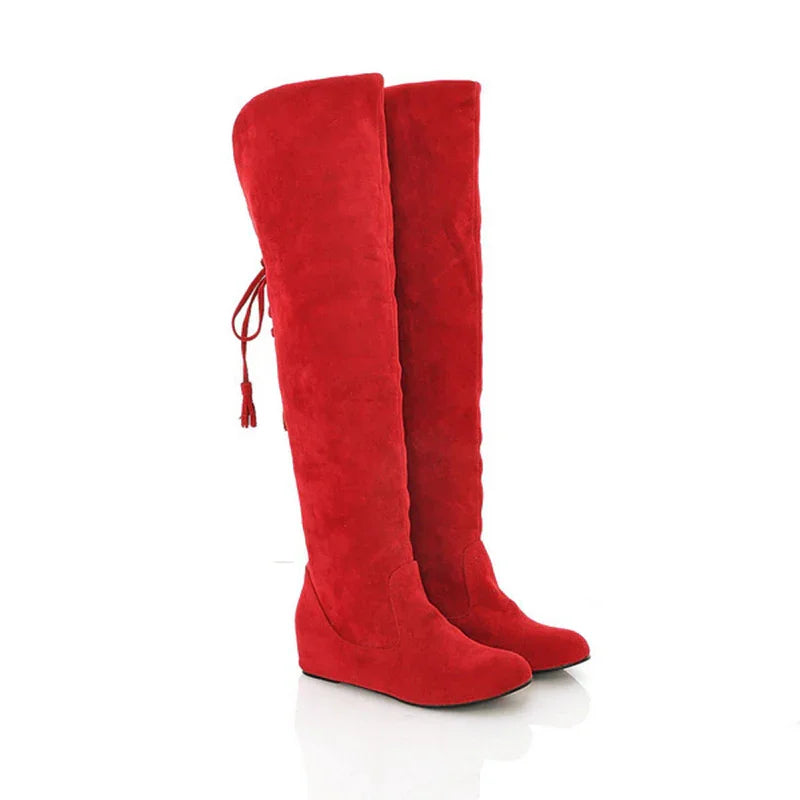 Pair of vibrant red over-the-knee suede wedge boots with back lace-up tassel detail
