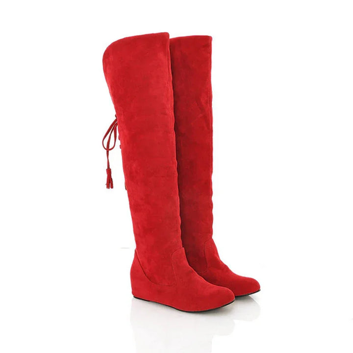 Pair of vibrant red over-the-knee suede wedge boots with back lace-up tassel detail