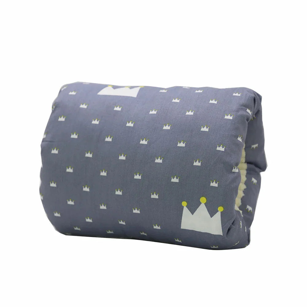 Gray lumbar pillow with white and yellow crown patterns on a white background