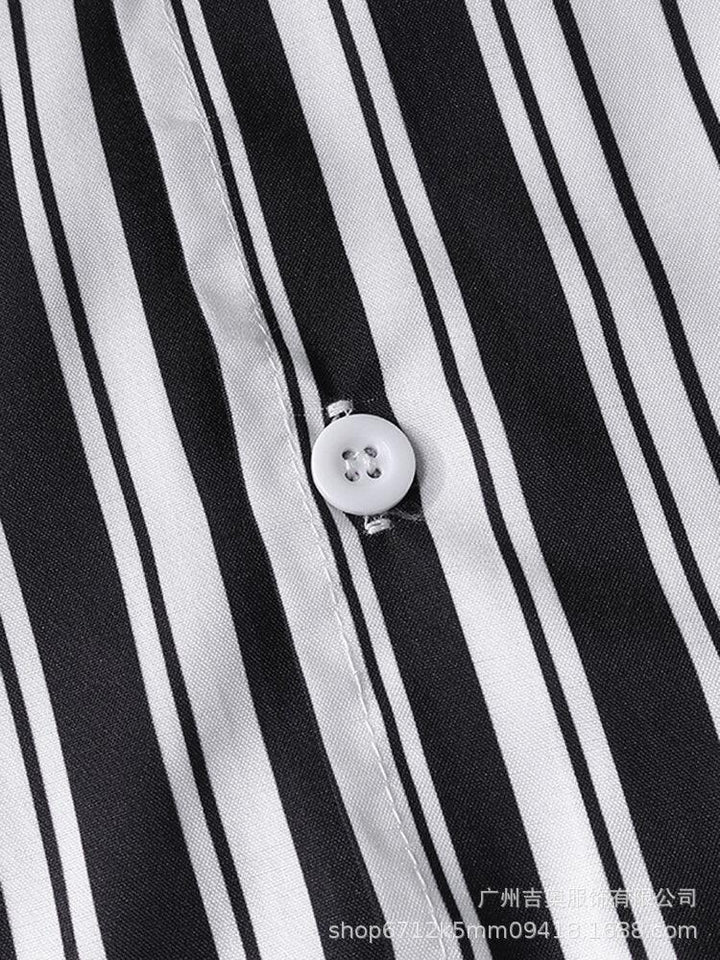 Close-up of black and white striped fabric with a white button and detailed stitching