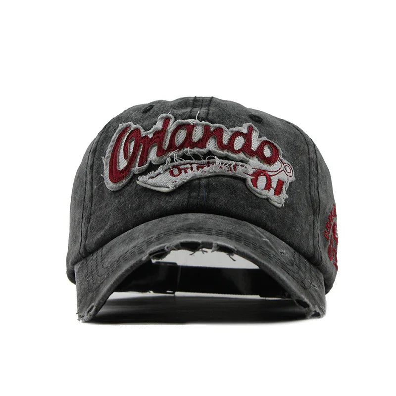worn grey baseball cap with red embroidered Orlando text and distressed design