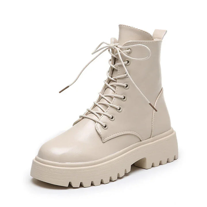 Beige leather lace-up combat boot with chunky ridged sole and ankle height