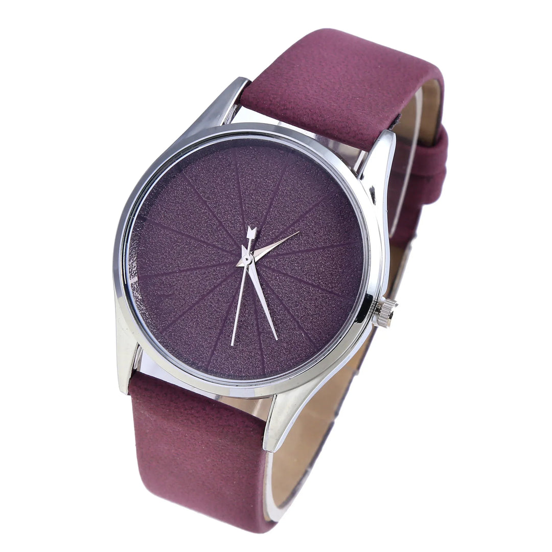 Purple textured dial wristwatch with silver case and matching purple leather strap