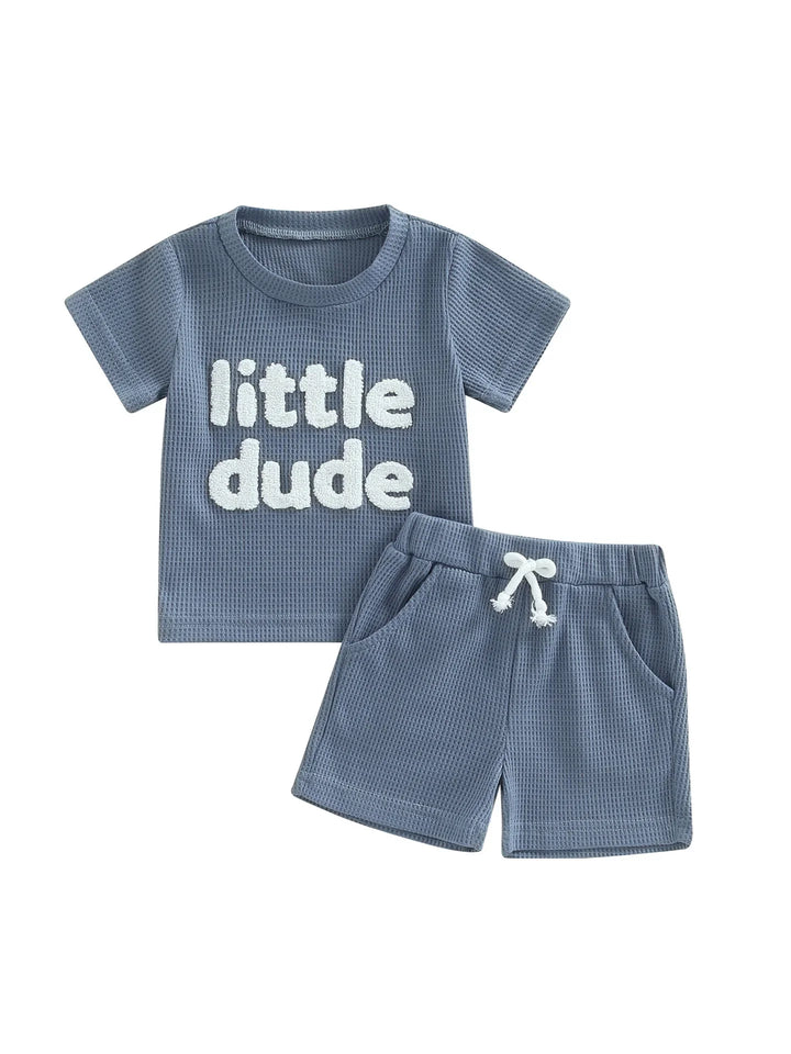 Blue toddler outfit set with textured fabric, 'little dude' shirt and matching shorts with drawstring