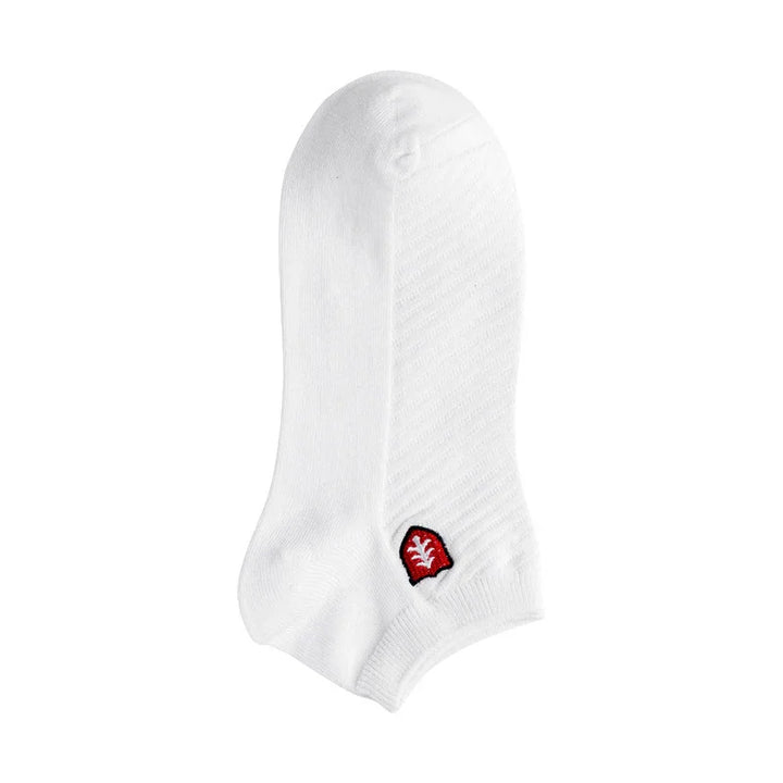 White ankle sock with a small red and white leaf logo on the side, isolated on white background