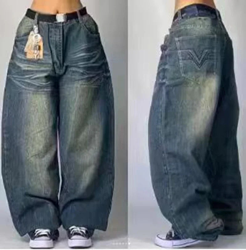 Wide-leg baggy blue denim jeans with faded wash, worn with white sneakers, front and side views