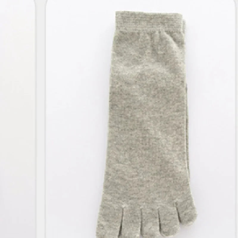 Single grey toe sock flat lay on white background, breathable cotton blend fabric