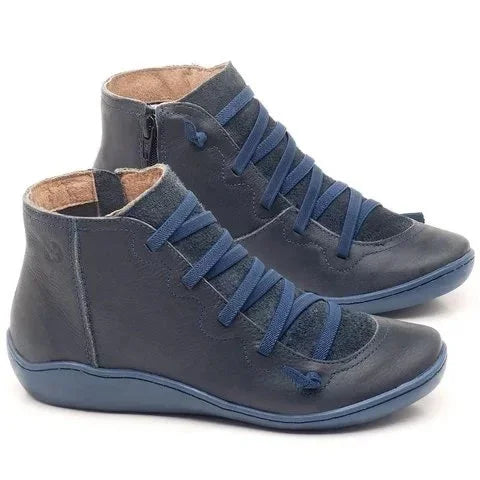 Dark blue leather ankle boots with side zipper and elastic laces, cushioned interior