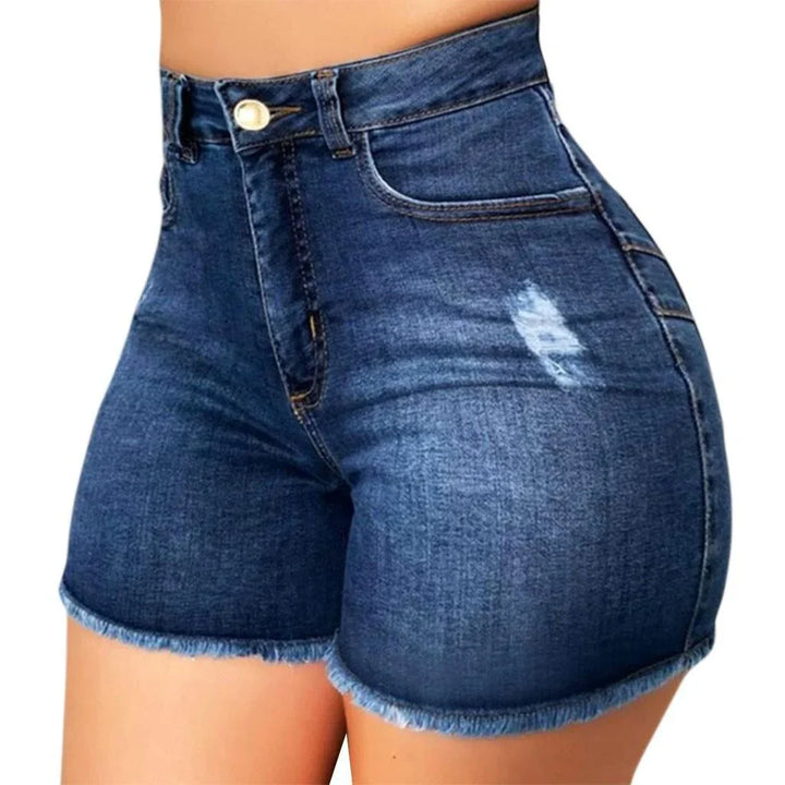 Close-up of high waist dark blue denim shorts with frayed hem and distressed detail