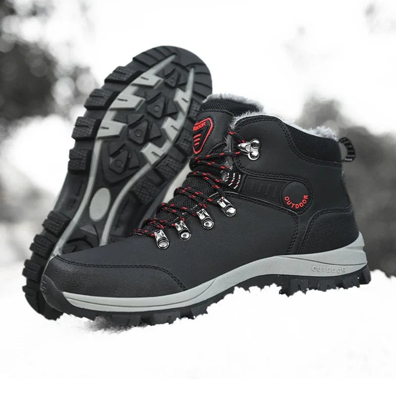 Black outdoor hiking boots with red accents and rugged soles on snow background