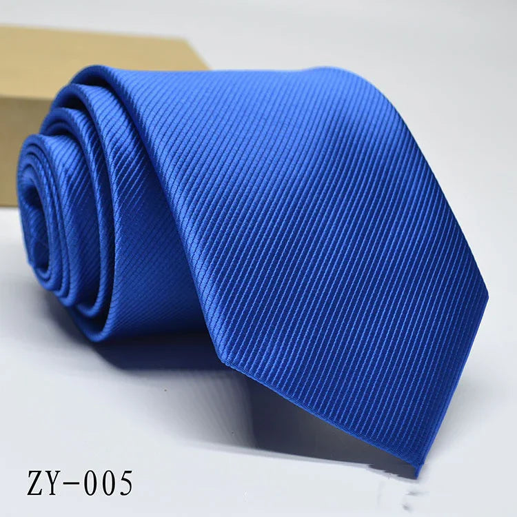 Close-up of a rolled blue striped necktie on a white surface with model number ZY-005