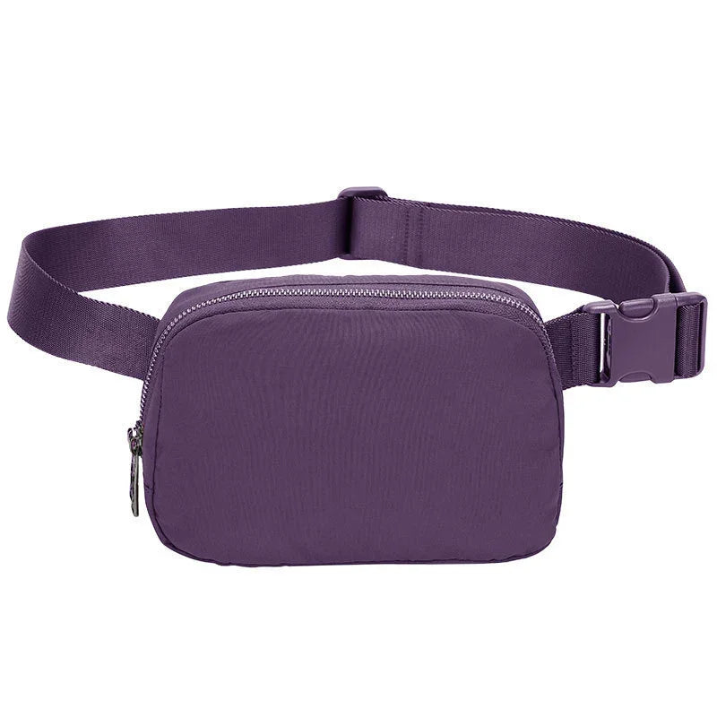 Compact purple waist bag with adjustable strap and zipper closure on white background