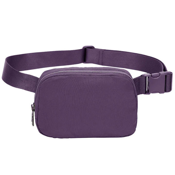 Compact purple waist bag with adjustable strap and zipper closure on white background