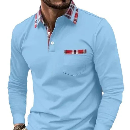 Man wearing light blue long-sleeve shirt with red plaid collar and pocket trim