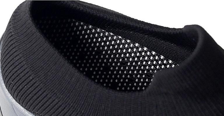 Close-up of black knit collar and mesh lining on casual sneaker