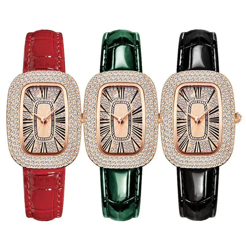Set of three rectangular rose gold watches with crystal-studded bezels and red, green, and black leather straps