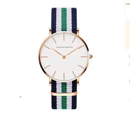 Hannah Martin minimalist wristwatch with white dial, rose gold case, and navy blue, white, green striped nylon strap