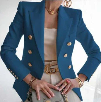 Woman wearing stylish blue double-breasted blazer with gold buttons, beige outfit, and designer accessories