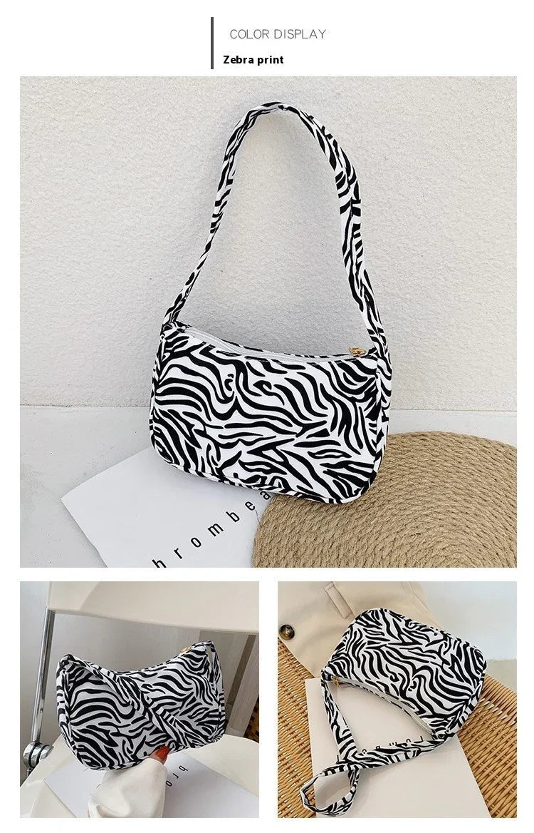 Zebra print shoulder bag with black and white pattern displayed in multiple angles on neutral backgrounds