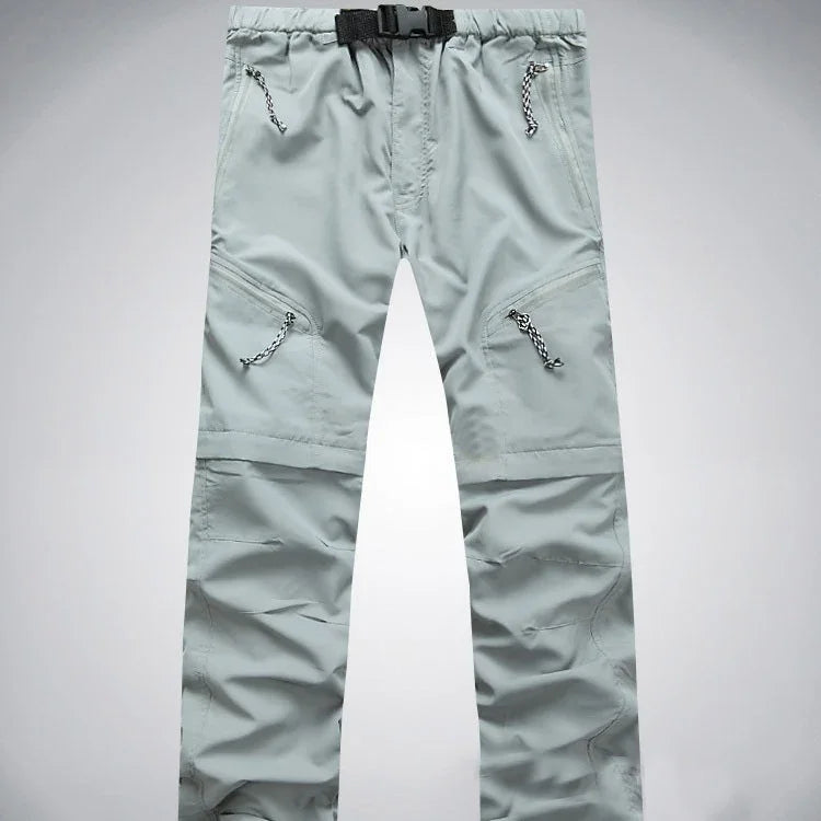 Light gray cargo pants with front zipper pockets and adjustable black buckle waist belt