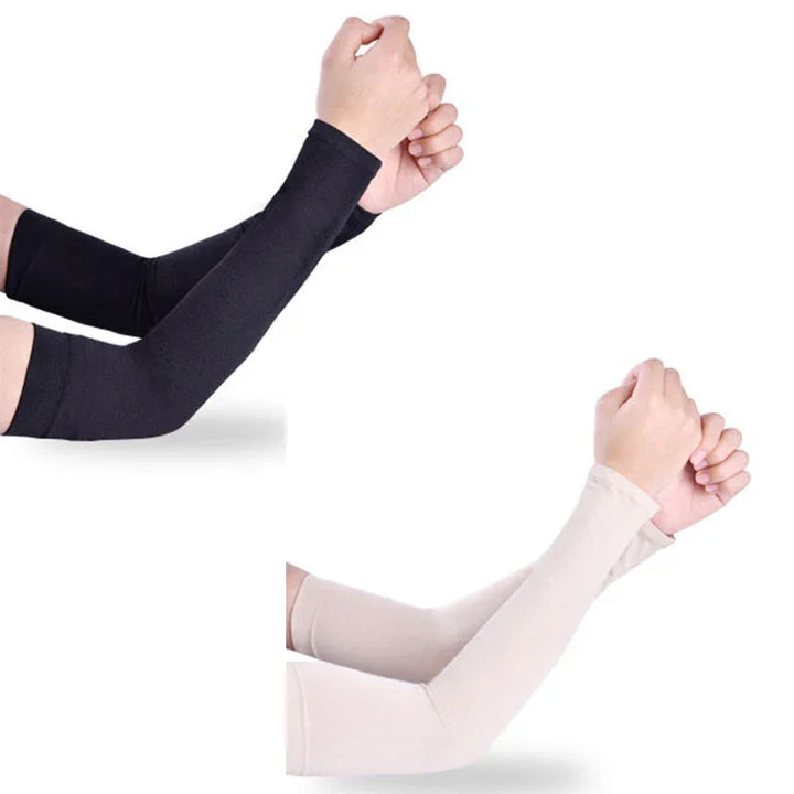 Pair of black and beige arm sleeves worn on both arms with fists clenched against white background