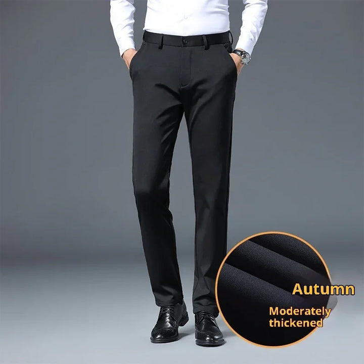 Men's black dress pants with hands in pockets, leather shoes, fabric close-up labeled autumn moderately thickened