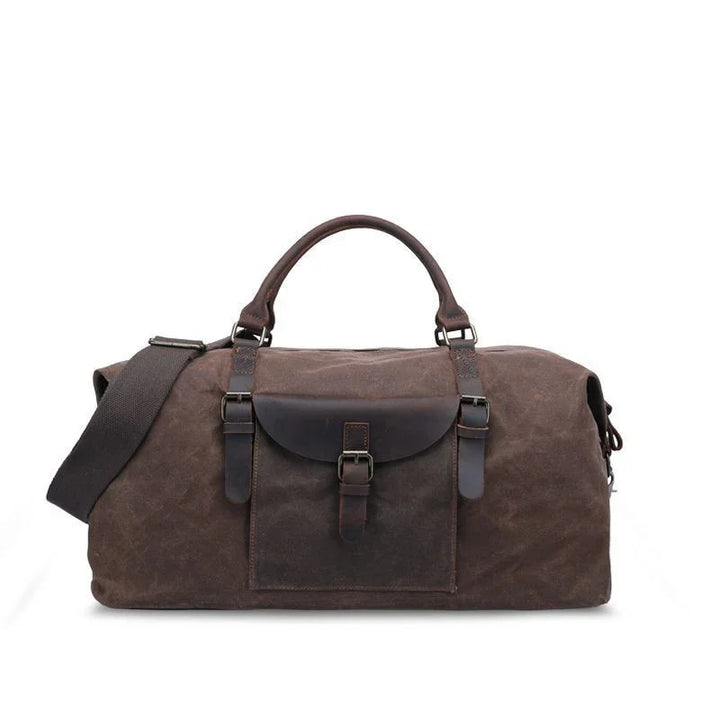 brown canvas and leather duffel bag with front buckle pocket and adjustable shoulder strap