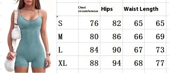 Woman in teal sleeveless romper with white handbag standing next to size chart for chest, hips, waist measurements