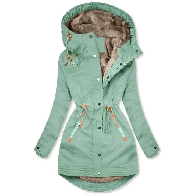 Mint green women's winter parka with faux fur lining, adjustable waist, and hood