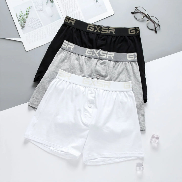 Set of three men's cotton boxer shorts in black, grey, and white with GXSR logo waistband