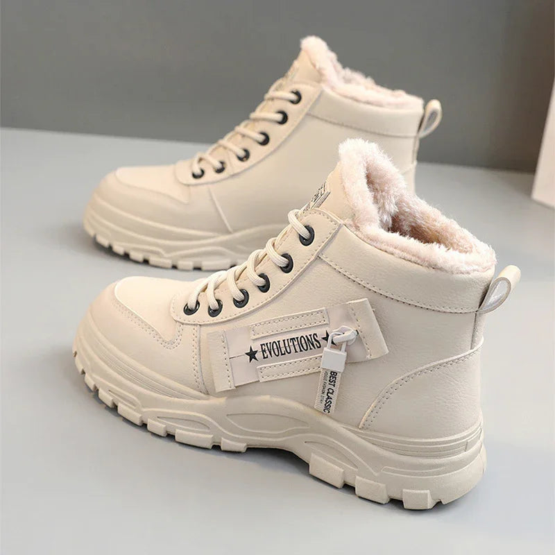 Cream-colored winter boots with fur lining, thick soles, and Evolutions label detail