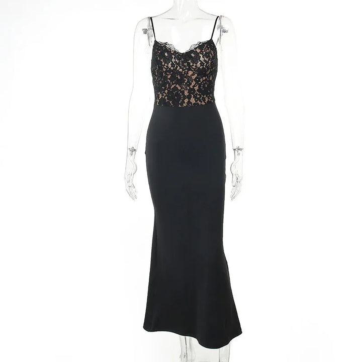 Elegant black evening gown with lace bodice and spaghetti straps on transparent mannequin