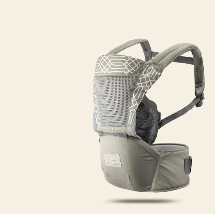 gray ergonomic baby carrier with breathable mesh and adjustable straps on beige background
