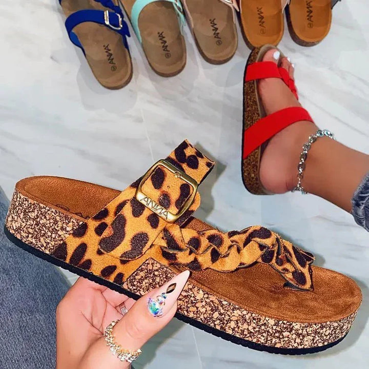 Leopard print platform sandals with braided strap and buckle, casual open-toe footwear on marble floor