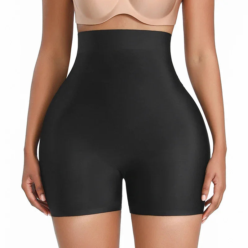 Woman wearing black high-waisted shapewear shorts designed for body contouring and waist slimming