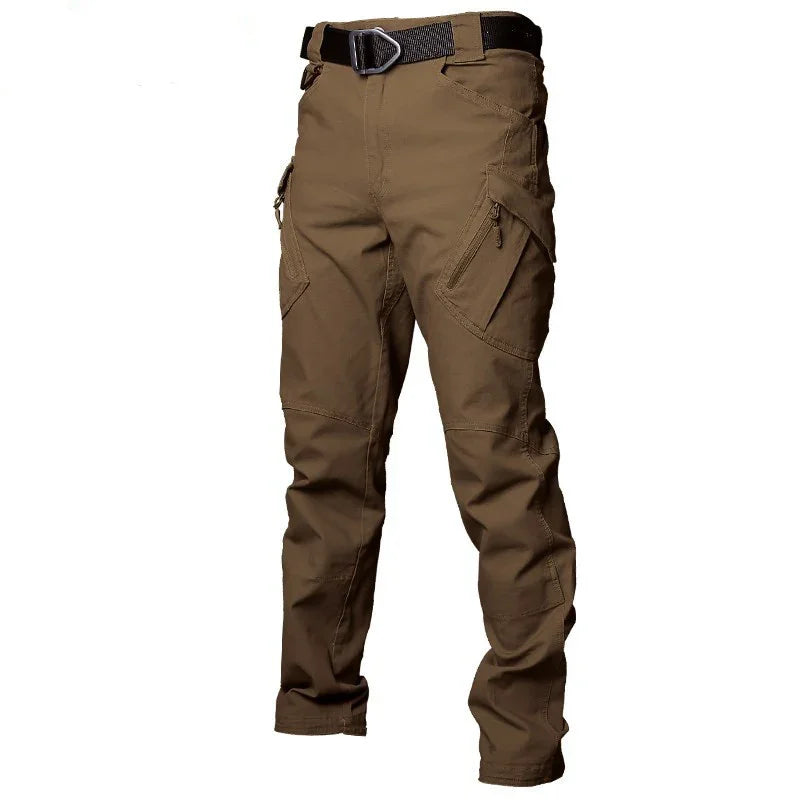 Brown tactical cargo pants with multiple zippered pockets and black belt on white background