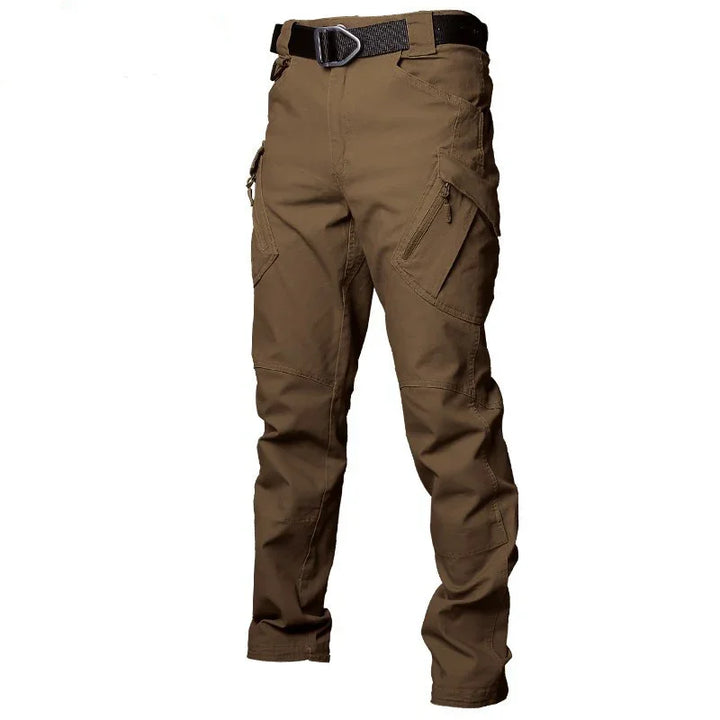 Brown tactical cargo pants with multiple zippered pockets and black belt on white background