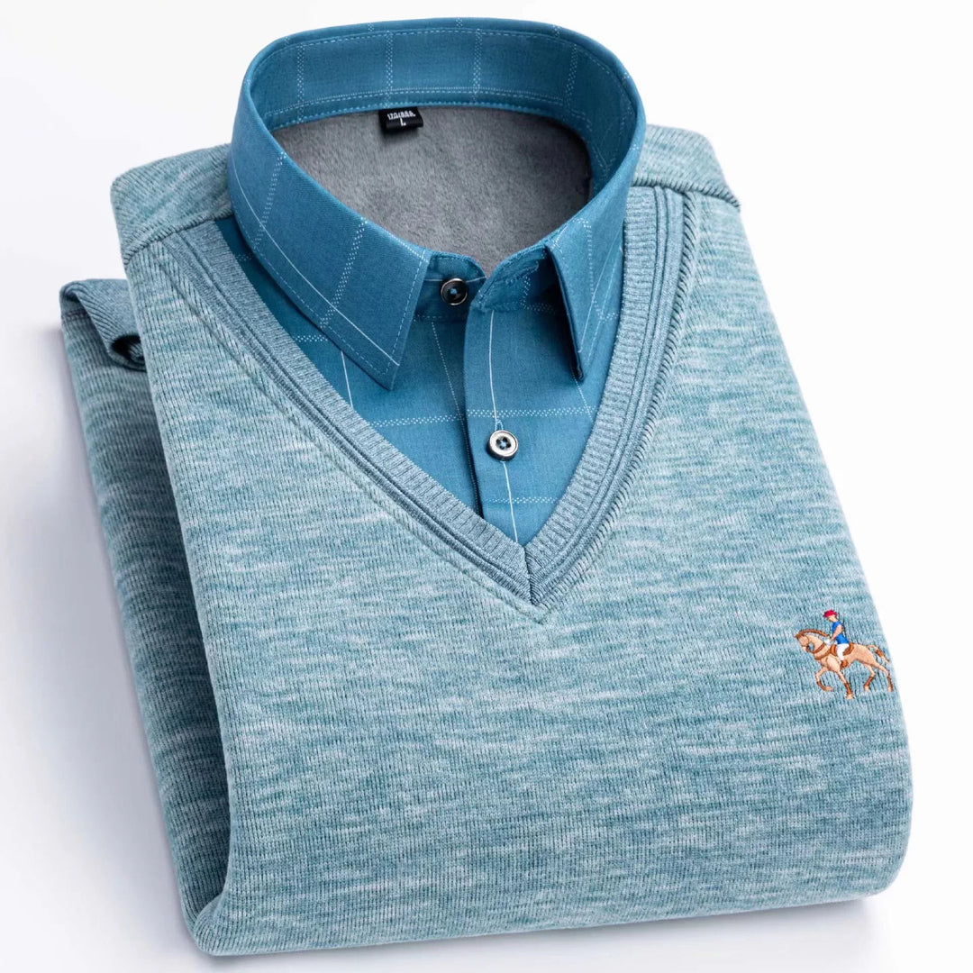 Folded blue checked dress shirt with light blue v-neck sweater featuring small horse rider embroidery