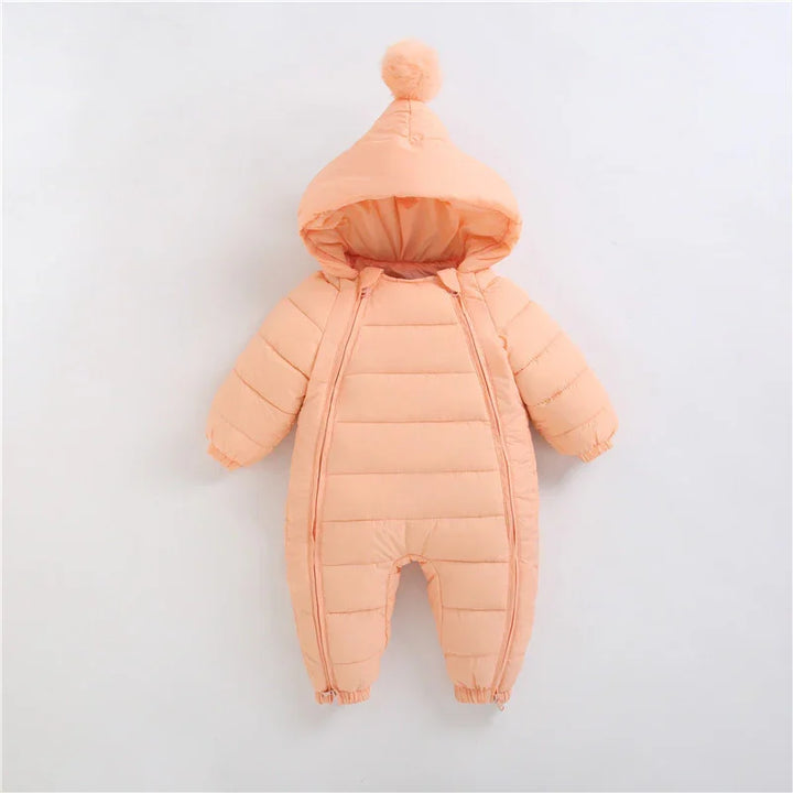 Peach-colored padded baby snowsuit with hood and pom-pom on top, front zipper, and elastic cuffs